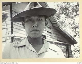 1943-03-03. PAPUA. JAPANESE UNSUCCESSFULLY ATTACK WAU. A COOLIE BOY BROUGHT BY THE JAPANESE TO ACT AS A CARRIER IN NEW GUINEA. THIS BOY DESERTED THE JAPANESE AT WAU AND CAME ACROSS TO THE ALLIED ..