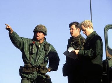 Forward air controllers are instructed by an Army range controller on directing the target strike of an F-4 Phantom II aircraft. The controllers are assigned to the 22nd Tactical Air Support Squadron, involved in Exercise Opportune Journey 4