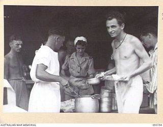 BOUGAINVILLE, 1945-06-18. SISTER M.M. MCINNES (1), SUPERVISING AND SERVING MESS PARADE FOR WALKING PATIENTS AT 109 CASUALTY CLEARING STATION, MOTUPENA POINT