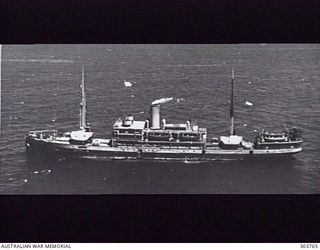 AERIAL PORT SIDE VIEW OF THE DUTCH PASSENGER CARGO VESSEL PATRAS WHICH TOOK TROOPS OF GULL FORCE TO AMBON ON 1941-12. SHE WAS ALSO INVOLVED IN OPERATION LILLIPUT IN NORTHERN NEW GUINEA BETWEEN ..