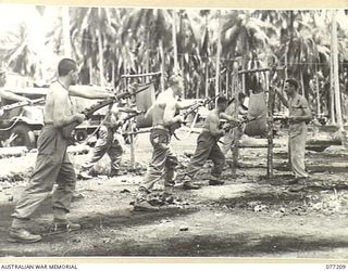 MADANG, NEW GUINEA. 1944-12-14. TROOPS OF THE 2/4TH ARMOURED REGIMENT ENGAGED IN BAYONET DRILL ON THE UNIT PARADE GROUND. IDENTIFIED PERSONNEL ARE:- VX51620 CAPTAIN C.F. SUFFREN (1); NX54935 ..