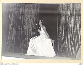 PALMALMAL, NEW BRITAIN. 1945-09-04. THE FEMALE IMPERSONATOR, DONALDSON, PERFORMING DURING THE LAST CONCERT PRESENTED IN NEW BRITAIN AT 2/8 GENERAL HOSPITAL BY THE "BOOMERANGS" CONCERT PARTY, WHO ..