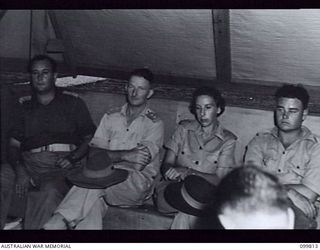 RABAUL, NEW BRITAIN, 1946-02-06. CAPTAIN CANEMAN (1), LIEUTENANT H. KEANE (2) AND CAPTAIN H. WITT, AUSTRALIAN ARMY MEDICAL WOMEN'S SERVICE, 118 GENERAL HOSPITAL (3) AWAITING RADIO PHONE CALLS TO ..