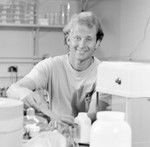 Michael Edward Huber, a Scripps Institution of Oceanography graduate student, conducts experiments in his lab. His 1983 Thesis (Ph.D.) was titled: Ethology and population biology of Trapezia, a xanthid crab symbiotic with reef corals : with special reference to territoriality and speciation. In 1988, Huber moved to the University of Papua New Guinea to study and dive on some of the world's most spectacular coral reefs. He served as Head of the University's marine research station on Motupore Island, and became increasingly interested in marine environmental science, especially with regard to reefs, mangroves, seagrass beds, and other tropical systems. This interest continued to grow during four years as Director of a marine research station on the Great Barrier Reef. November 3, 1980