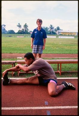 Young male athlete stretching,Tonga