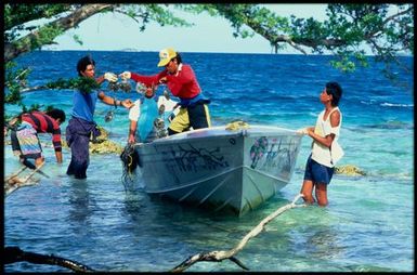 Group with pearl shells in lagoon, Cook Islands