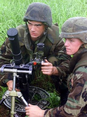 Lance Corporal (LCpl) Micheal Schrum, A-gunner, and LCpl Kenneth Konopka, gunner, from 3rd Battalion, 7th Marines, India Company, set up M224 60mm morters in preperation for an airfield seizure during Exercise KOA THUNDER 2001. KOA THUNDER is an exercise involving elements of 1ST Marine Air Wing (MAW), and 3rd Marine Division, where Marines conduct an Operational Readiness Exercise (ORE). The Aviation Support Element (ASE) from Kaneohe Bay, Hawaii, will be tested on command and control of several different missions, to include Tactical Recovery of Aircraft and Personal (TRAP), airfield seizures, and a Noncombatant Evacuation Operation (NEO)