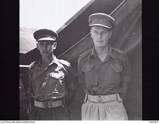 CAPE WOM, WEWAK AREA, NEW GUINEA. 1945-09-01. MAJOR D.W. MACPHERSON, DEPUTY ASSISTANT DIRECTOR OF MEDICAL SERVICES (1) AND MAJOR G. READ, DEPUTY ASSISTANT DIRECTOR OF HOSPITALS (2). THE MEN ARE ..