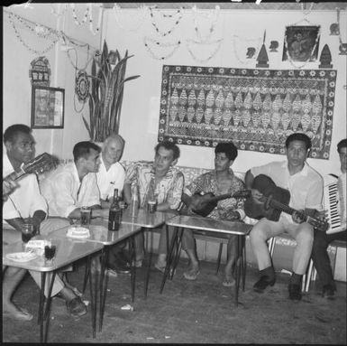 Group of people with guitars in a bar, Noumea, New Caledonia, 1967, 2 / Michael Terry