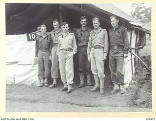 DUMPU, RAMU VALLEY, NEW GUINEA. 1944-02-09. PERSONNEL OF THE INTELLIGENCE SECTION OF 18TH INFANTRY BRIGADE HEADQUARTERS. LEFT TO RIGHT: QX34872 CORPORAL P. WARD (1); QX11374 CORPORAL A.F. HARTLEY ..