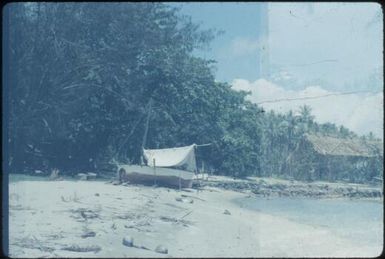 Our own boat, Lisu (meaning 'wave') on Mapamoiwa beach, looking towards station : Mapamoiwa Station, D'Entrecasteaux Islands, Papua New Guinea, 1956-1959 / Terence and Margaret Spencer