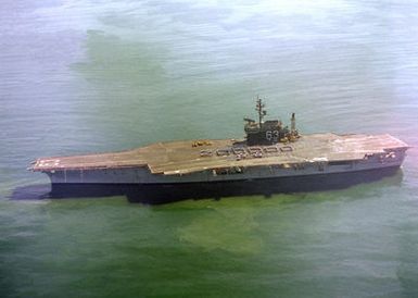 A port view of the USS KITTY HAWK (CV-63) as crewmen form the number "200,000" on the flight deck. AN S-3A Viking has just made the 200,000th aircraft landing aboard the aircraft carrier