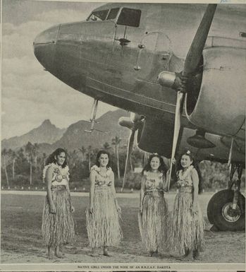 Native girls under the nose of an R.N.Z.A.F. Dakota