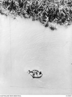 WEWAK AREA, NORTH EAST NEW GUINEA. C. 1945-06. IN ONE OF THE MOST AUDACIOUS RESCUES EVER CARRIED OUT BY THE RAAF, LIEUTENANT (LT) J. P. CARTER, A TEXAS MEMBER OF THE UNITED STATES ARMY AIR FORCE ..