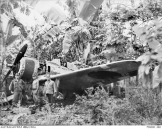 NEW BRITAIN, 1945-09. A JAPANESE NAKAJIMA Ki-43-I (SERIAL NUMBER 750) HAYABUSA "OSCAR" AIRCRAFT AT RABAUL. THIS MACHINE WAS REPAIRED AND PACKED BY JAPANESE SERVICEMEN THEN FORWARDED TO AUSTRALIA ..