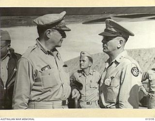 1943-07-07. NEW GUINEA. PACIFIC OFFENSIVE. GENERAL DOUGLAS MACARTHUR, WHO IS IN COMMAND OF THE ALLIED OFFENSIVES IN NEW GUINEA AND THE SOLOMONS, PHOTOGRAPHED BESIDE HIS PLANE IN NEW GUINEA. WITH ..