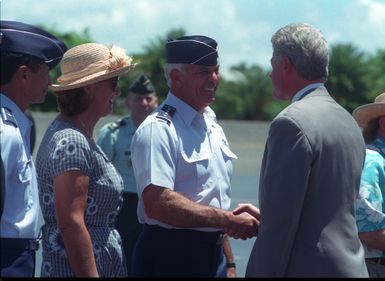 GEN. John G. Lorber, Commander USPACOM, and his wife, greet President William Jefferson Clinton upon his arrival for the commemoration of the 50th anniversary of World War II