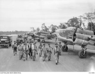 TADJI NEAR AITAPE, NORTH EAST NEW GUINEA. C. 1944-10. AFTER ANOTHER SUCCESSFUL SORTIE CONCLUDED, CREWS FROM AUSTRALIAN BUILT BEAUFORT BOMBER AIRCRAFT OF NO. 8 SQUADRON RAAF WALK PAST A LINEUP OF ..