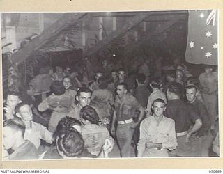 TOROKINA, BOUGAINVILLE. 1945-04-16. A SECTION OF THE CROWD WHO ATTENDED THE DANCE HELD IN THE OTHER RANKS CLUB, HALSEY FIELD