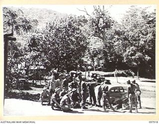 RABAUL, NEW BRITAIN. 1945-10-12. TRANSPORT SECTION PERSONNEL, HEADQUARTERS 11 DIVISION, IN THE TRANSPORT SECTION AREA