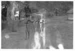 Children carrying logs