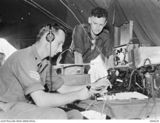 LAMARIEN, HENRY REID BAY, NEW BRITAIN, 1945-07-29. TWO TIMOR VETERANS, NOW MEMBERS OF 2/2 COMMANDO SQUADRON, SERGEANT J. SERVANTE (1) AND SERGEANT R.S. KIRKWOOD (2). SERGEANT SERVANTE OPERATED THE ..