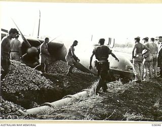 PORT MORESBY, PAPUA. 1942-07-25. A MARAUDER (B26) BOMBER AIRCRAFT OF US AIR FORCE 22ND BOMB GROUP MAKING A FORCED LANDING ON THE AIRFIELD AT SEVEN MILE STRIP PLOUGHED THROUGH THE EARTH UNTIL ..