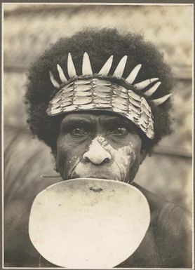 Close up view of a spearman of Wamira, North Coast [wearing shell jewellery] Frank Hurley