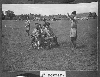 Members of the Tonga Defence Force of 2nd NZEF, training with a 3" mortar in Tonga