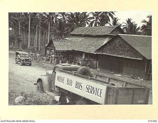 MILNE BAY, NEW GUINEA, 1944-02-12. THE DINING SECTION OF THE TROOPS' CLUB, ESTABLISHED BY THE AUSTRALIAN ARMY CANTEENS SERVICE AND NOW CHIEFLY PATRONIZED BY AMERICAN SERVICEMEN. A REGULAR BUS ..