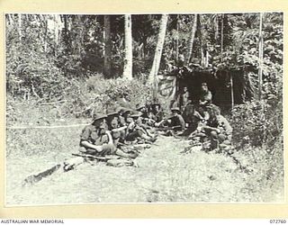 BOGADJIM, NEW GUINEA. 1944-04-26. MEMBERS OF A PATROL FROM C COMPANY, 57/60TH INFANTRY BATTALION AT A SALVATION ARMY RED SHIELD HUT A BOGADJIM AFTER RETURNING FROM A PATROL TO MADANG. THEY WERE THE ..