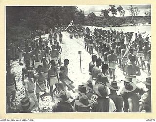 KELANOA, NEW GUINEA, 1944-02-20. THE GRAND MARCHPAST AT A BEACH CARNIVAL ORGANISED BY CAPTAIN A.E. RICHARDS AND SERGEANT P.J. HORAN OF THE AUSTRALIAN ARMY AMENITIES SECTION, 5TH DIVISION. 5TH ..