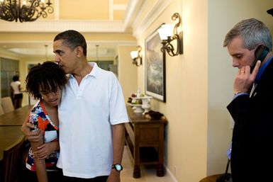 President Barack Obama Hugs Malia Obama on Vacation in Kailua, Hawaii