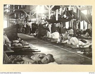 ALEXISHAFEN, NEW GUINEA. 1944-05-15. THE MAIN WARD AT THE MAIN DRESSING STATION, 2/15TH FIELD AMBULANCE. THE BUILDING WAS THE FORMER HOSPITAL IN THE OLD CATHOLIC MISSION