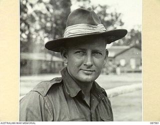 Informal portrait of WX9876 Corporal (Cpl) Timothy Joseph Ryan MM, 2/48 Battalion, of Midland Junction, WA. A railway employee prior to enlisting he received his Military Medal award for service at ..