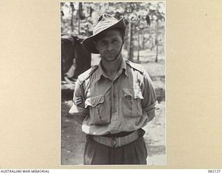 LAE, NEW GUINEA. 1944-10. SERGEANT V. COLLINS, NO. 2 MILITARY HISTORY SECTION FIELD TEAM, HEADQUARTERS FIRST ARMY