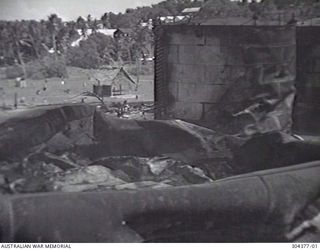 NAURU. 1940-12. WRECKAGE OF THE OIL FUEL TANKS AFTER THE BOMBARDMENT BY THE GERMAN AUXILIARY CRUISER KOMET ON 1940-12-27. (NAVAL HISTORICAL COLLECTION)