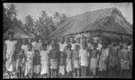 Group portrait by a house