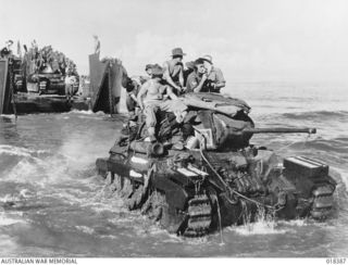 Bougainville. 28 March 1945. Australian-manned Matilda tanks of B Squadron, 2/4 Armoured Regiment being landed at Toko Beach from American landing crafts, tank (LCTs) prior to moving into action