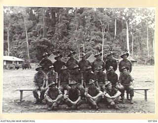 Group portrait of members of 12 Platoon, B Company, 58/59 Infantry Battalion. Identified, back row, left to right: Private (Pte) R Lewis; Pte Tullipan; Pte Rosewarne; Corporal (Cpl) Nixon; Pte T ..