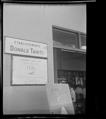 Signs in Tahiti advertising 'Etablissements Donald Tahiti' and 'Etablissements Donald Tahiti TEAL' (Tasman Empire Airways Limited)