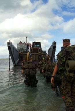 A Landing Force from Marine Expeditionary Unit Service Support Group (MSSG) 31 board a Landing Craft, Utility 1634 (LCU) as part of their amphibious training at the Inner Apra Harbor, Guam in support of Exercise TANDEM THRUST 2003