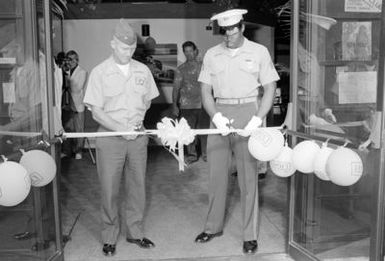 Colonel (COL) Castanetti and Sergeant (SGT) Wiggs cut the ribbon during the opening of the new enlisted club