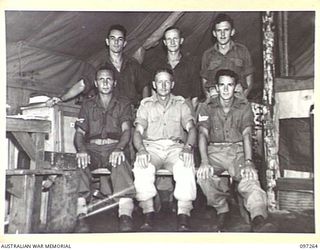 CAPE WOM, NEW GUINEA. 1945-09-29. THE GROUP OF STAFF THAT MAINTAIN RADIO 6 DIVISION BROADCASTING STATION AT HEADQUARTERS 6 DIVISION. THE STATION REOPENED ON 6 SEPTEMBER 1945. IDENTIFIED PERSONNEL ..