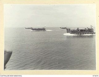 AT SEA, NEW GUINEA. 1944-05-31. AMERICAN LANDING BARGES CONVEYING MEMBERS OF THE 37/52ND INFANTRY BATTALION TO THE FORWARD BASE AT SARANG HARBOUR IN PREPARATIONS FOR THE BEACH LANDING ON KARKAR ..