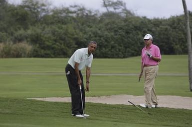 Barack Obama plays golf with Prime Minister Najib Razak, Joe Paulsen, and Mike Brush in Kaneohe Bay, Hawaii, December 24, 2014