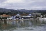 French Polynesia, view of waterfront buildings across harbor