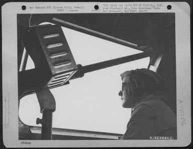 Sgt. Mathias Donart Poses Beside A Waist Gun On A Boeing B-17 "Flying Fortress", Hickam Field, Hawaii. (U.S. Air Force Number A62986AC)