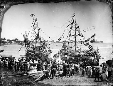 Crowd with decorated boats
