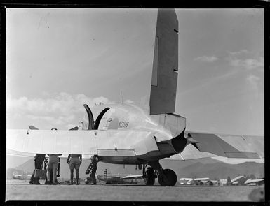 Tontouta Airfield and a rear view of a Dakota transport plane, New Caledonia